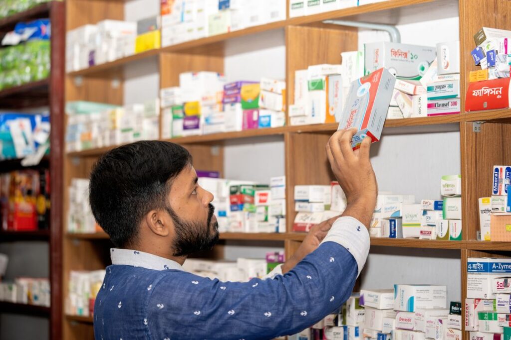 Professional pharmacist standing in a modern pharmacy